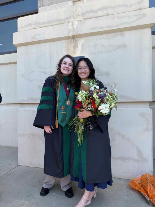 Dr. Mikaela Melnychuk with classmate and friend, Dr. Lea Hong, at medical school graduation.